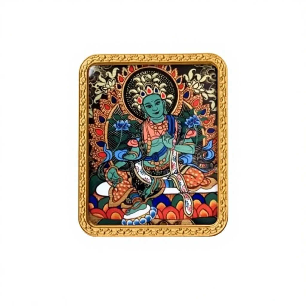 Hand-painted Green Tara miniature thangka pendant in a gold frame, studio shot
