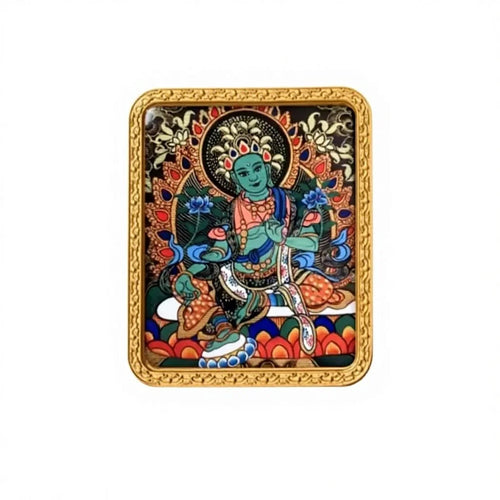 Hand-painted Green Tara miniature thangka pendant in a gold frame, studio shot