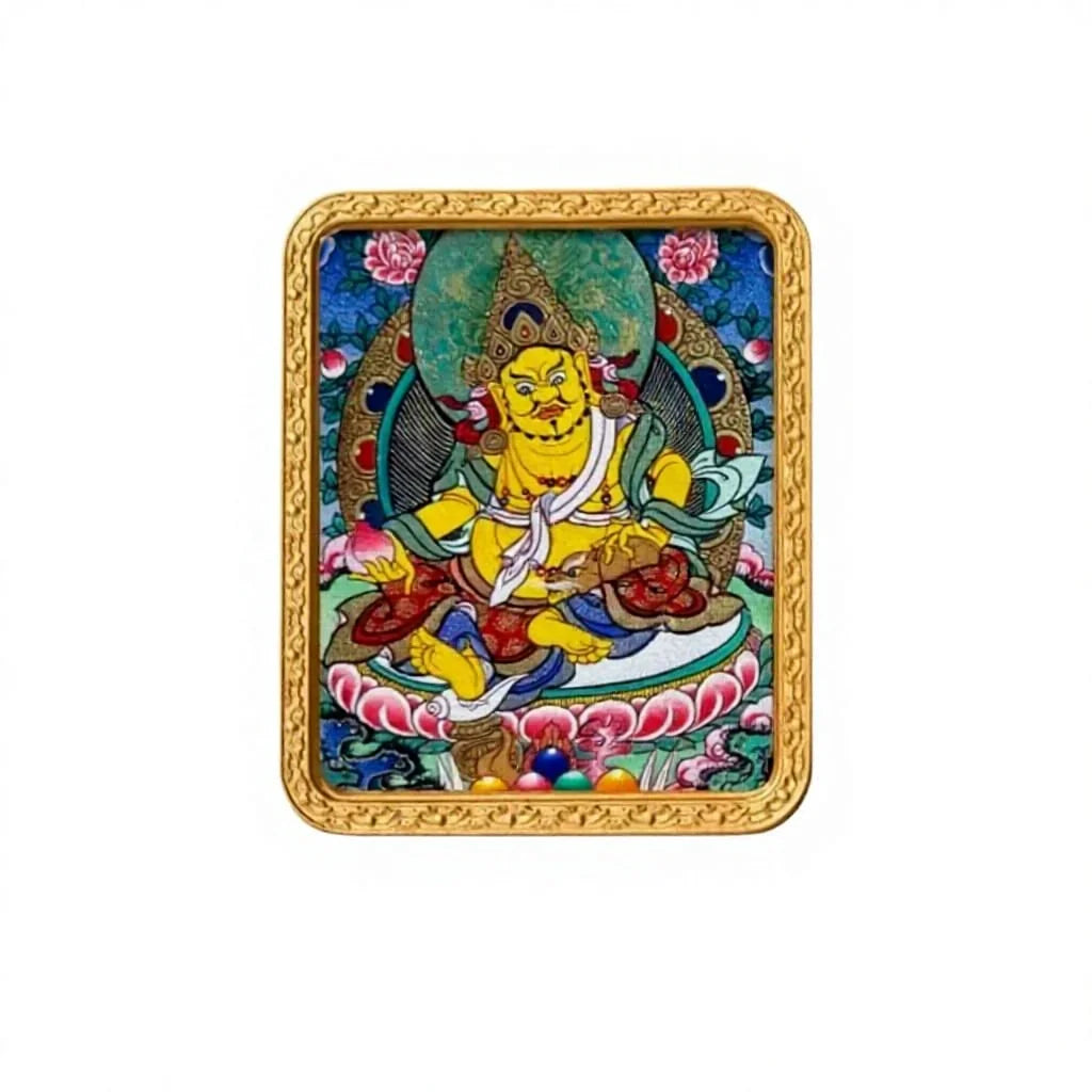 Hand-painted Yellow Jambhala miniature thangka pendant in a gold frame, studio shot