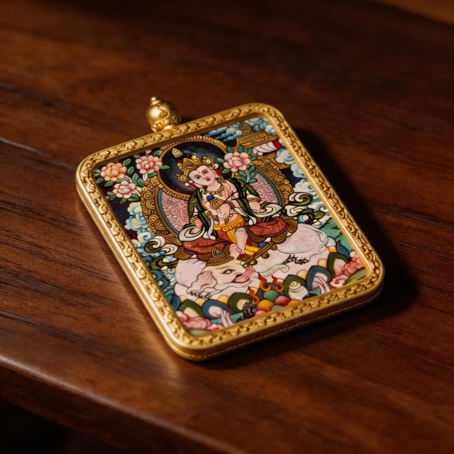 Hand-painted Samantabhadra miniature pendant displayed on a wooden surface