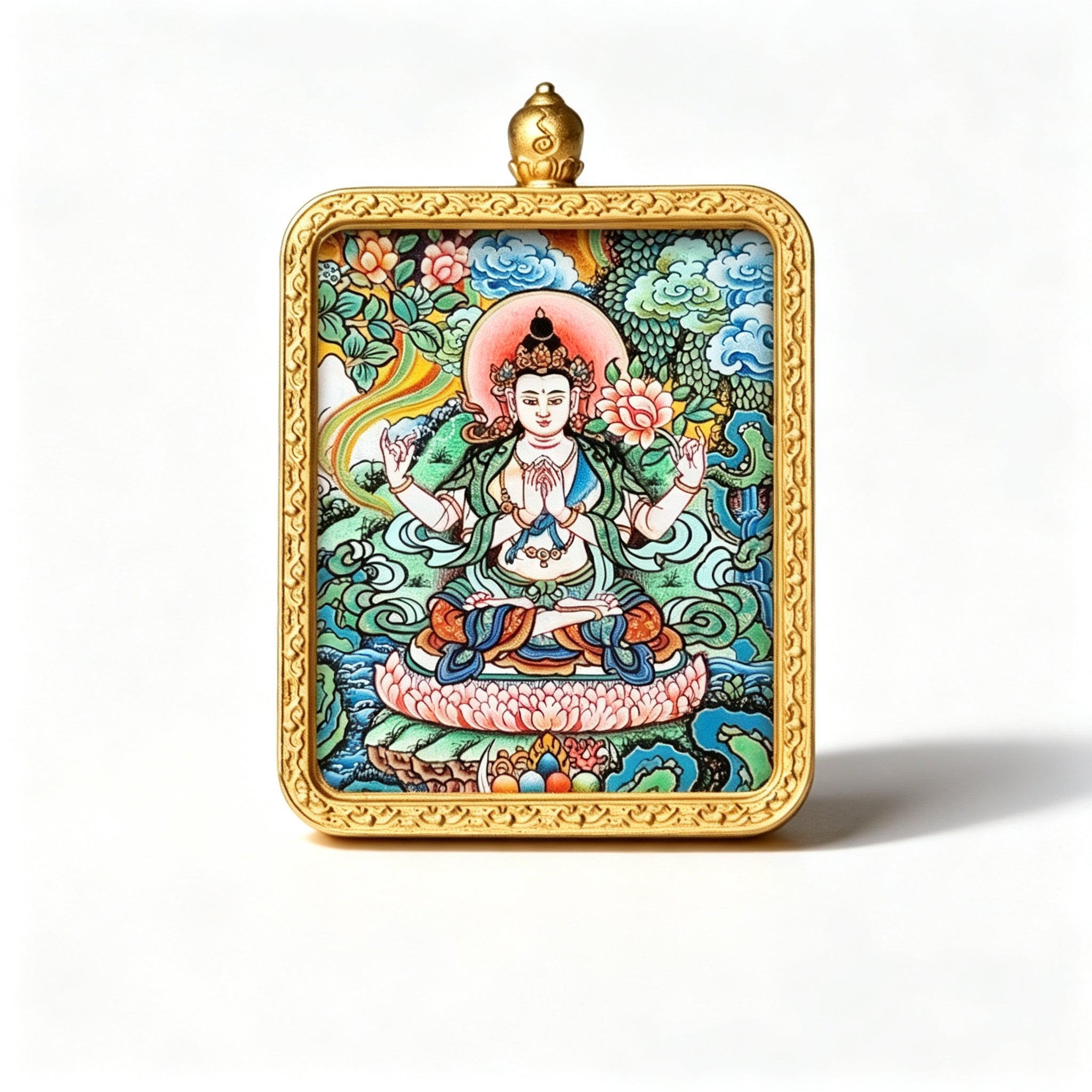 Hand-painted Tibetan miniature art pendant depicting Four-Armed Avalokiteshvara in a gold-tone frame — studio view